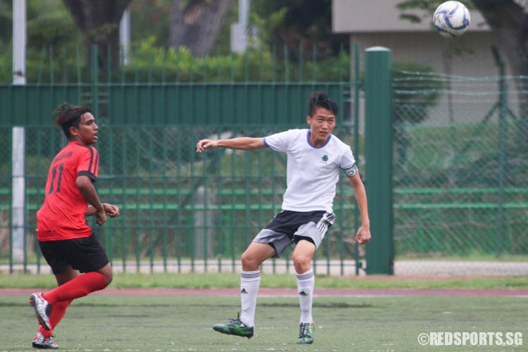 Aloysius Tung (St. Patrick's #2) goes for a header. (Photo © Chua Kai Yun/Red Sports)