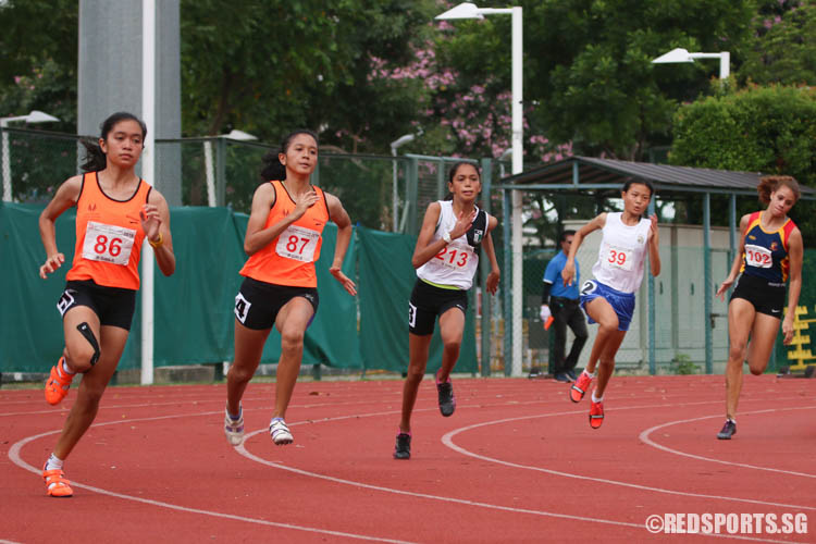 Athletes in action during the B Girls 200m event. (Photo © Chua Kai Yun/Red Sports)