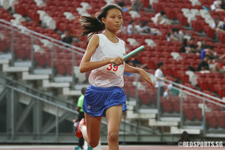 Rebecca Ong (#39) of CHIJ St. Nicholas Girls' runs the second leg of the 4x400m relay. (Photo © Chua Kai Yun/Red Sports)