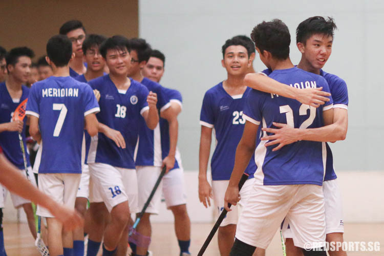 Captain Thaddeus Tan (#77) sharing a moment with Nur Hakim B Zahrin (#12), as MJC players enters the court after the final whistle. (Photo © Chua Kai Yun/Red Sports)