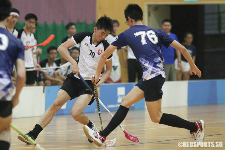 Lin Yao Hua (#10) of NYJC lost possession of the ball to Tan Zhu Yin (#76) of RVHS. (Photo © Chua Kai Yun/Red Sports)