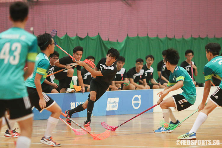 Poon Keng Yong (#11) of NYJC attempts to fire a goal against TJC defence but was unsuccessful. (Photo © Chua Kai Yun/Red Sports)