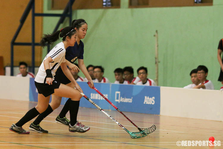 Players Elysia Low (HCI #11) and Lim Qian Hui (RVHS #8) contest for the ball. (Photo © Chua Kai Yun/Red Sports)