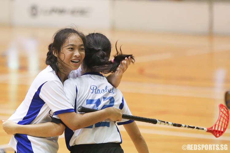 Lim Meng Gim (CJC #12) hugs Rachel Tan (#22) after scoring CJC's only goal. (Photo © Chua Kai Yun/Red Sports)