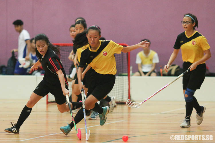 Audrey Tey (VJC #9) steers the ball away from Charmaine Neo (TPJC #10). (Photo © Chua Kai Yun/Red Sports)