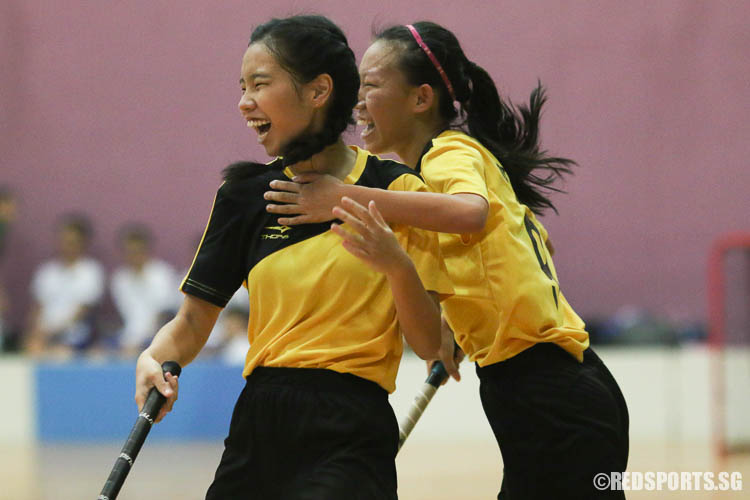 Natalie Tan (VJC #19, left) in jubilation after scoring a goal. (Photo © Chua Kai Yun/Red Sports)
