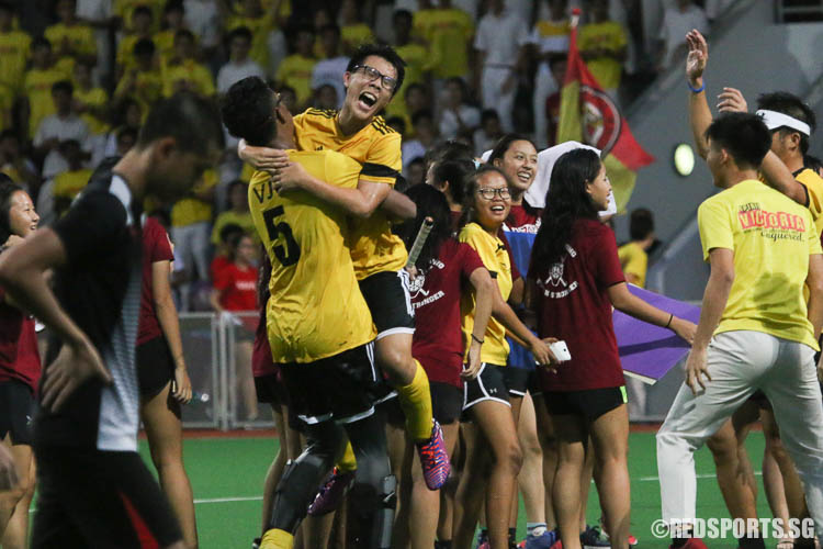 Wong Gene-Han (#11) celebrating his victory with teammate Danial Razif Shah (#5). (Photo © Chua Kai Yun/Red Sports)