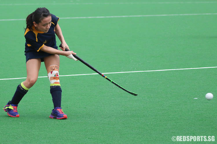 Mavis Tan (#13) slaps the ball against VJC. Despite her knee injury acting up at half time, she fought hard against VJC in the second half of the match. (Photo © Chua Kai Yun/Red Sports)