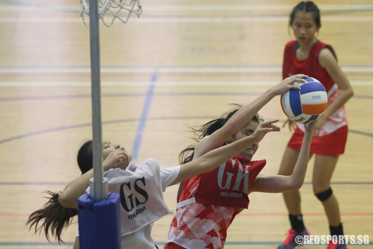 Yew Shu Ning (GK) of RVHS catches the rebound. (Photo © Chua Kai Yun/Red Sports)