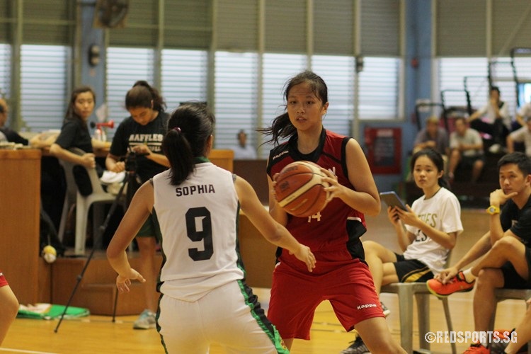 Sabrina Gao (DHS #14) readies herself for a dribble.