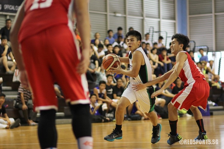 Krison Sum (RI #12) collects the ball and drives towards the basket.