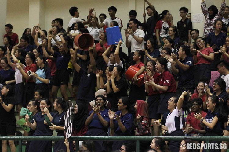 YJC supporters raising their pails in joy after YJC managed to pull off a stunning comeback. (Photo © Ryan Lim/Red Sports)