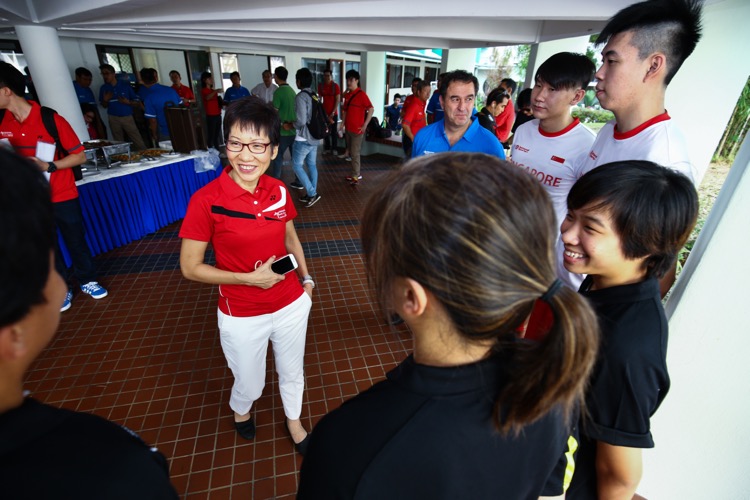 Minister for Culture, Community and Youth Grace Fu interacts with national basketball players during the Singapore Youth Olympic Festival 2016 Opening Ceremony at Anglican High School on June 17, 2016 in Singapore.