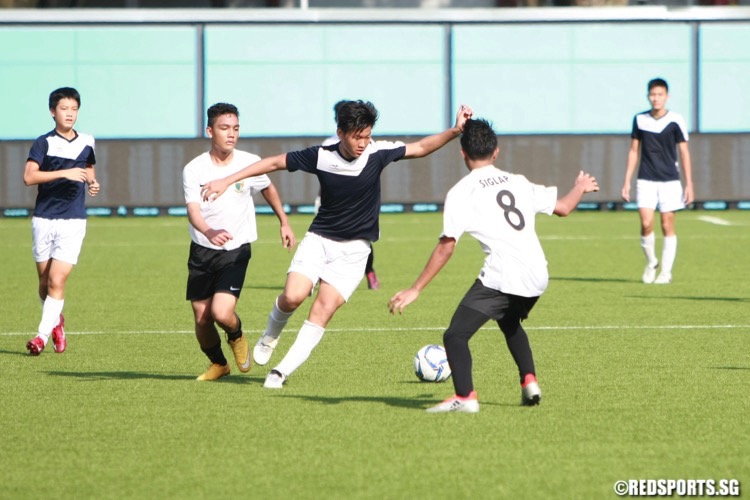 Siglap (white) came from 1-3 down to beat St Gabriel's 5-3 after extra time to grab third place in the National B Division Football Championship. (Photo © Les Tan/Red Sports)