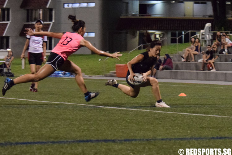 An SIM player receives a pass as she runs across the scoreline. (Photo 4 © Laura Lee/Red Sports)