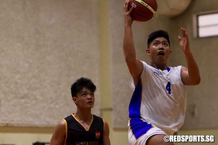 Ngee Ann Polytechnic (white) beat Singapore Polytechnic 49-42 for their first win in the POL-ITE Basketball Championship. (Photo © Les Tan/Red Sports)
