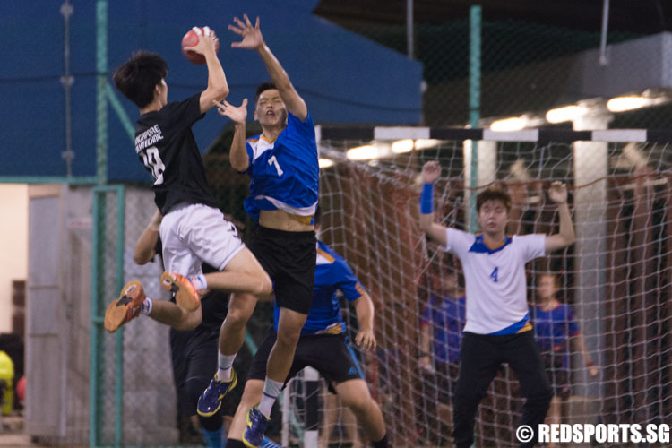 Chong Yao Hui (#1) of NP attempts to block the shot from Lucas Guet (#18) of SP. (Photo 4 © Jerald Ang/Red Sports)