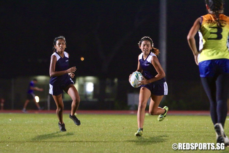 Nanyang Poly (blue) beat Singapore Poly 7-1 in their opening game of the POL-ITE Touch Football Championship. (Photo © Les Tan/Red Sports)