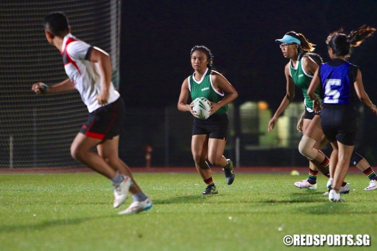 Republic Poly (green) beat ITE 8-0 to win their opening game of the POL-ITE Touch Football Championship. (Photo © Les Tan/Red Sports)