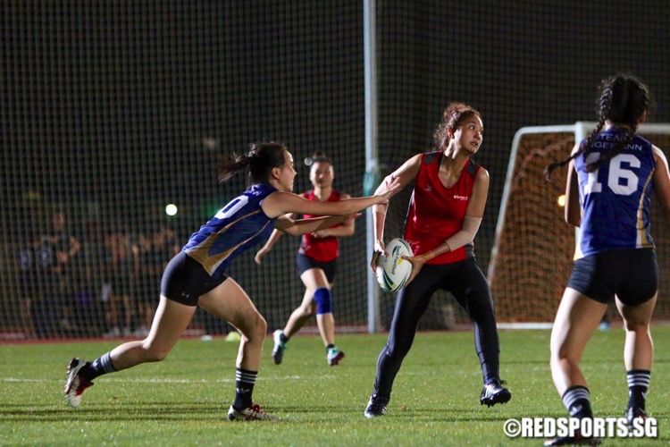 Temasek Poly (red) edged out Ngee Ann Poly (blue) 3-2 in their opening game of the POL-ITE Touch Football Championship. (Photo © Les Tan/Red Sports)
