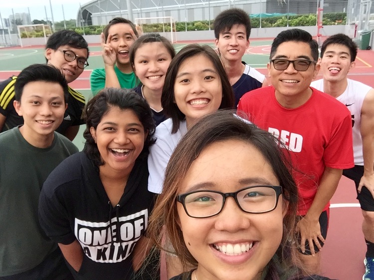Edina Tan taking a wefie with the Red Crew at a pick up basketball game at the Singapore Sports Hub.