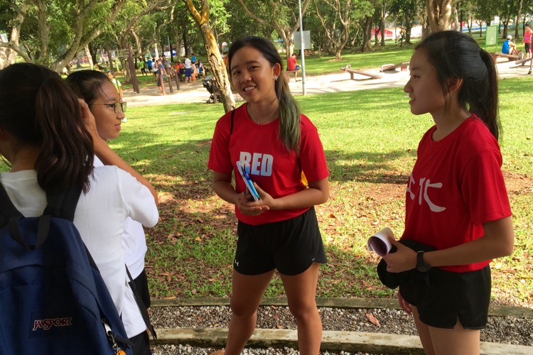 Edina Tan of Red Crew interviewing the River Valley High runners at the 2016 National Schools Cross-Country Championships.