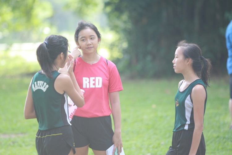 Edina Tan of Red Crew interviewing the Raffles Institution runners at the 2016 National Schools Cross-Country Championships.