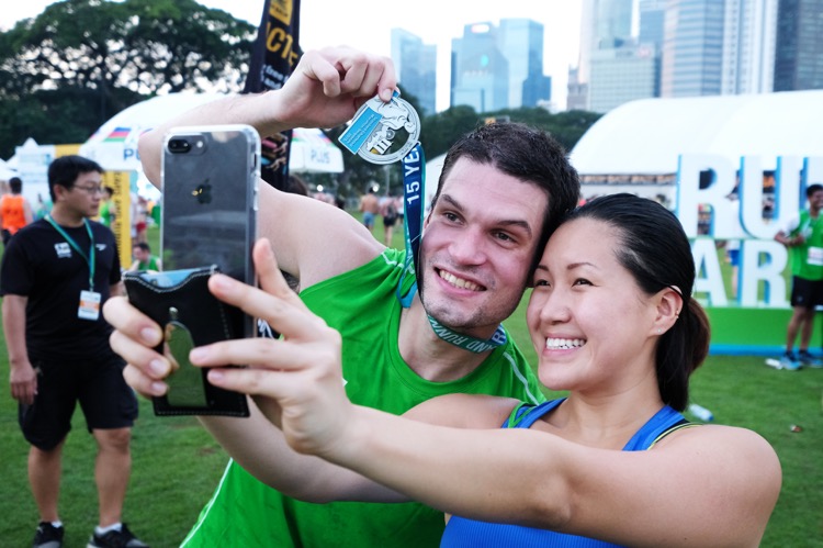 Celebrating a finish. (Photo 4 courtesy of Standard Chartered Marathon Singapore)
