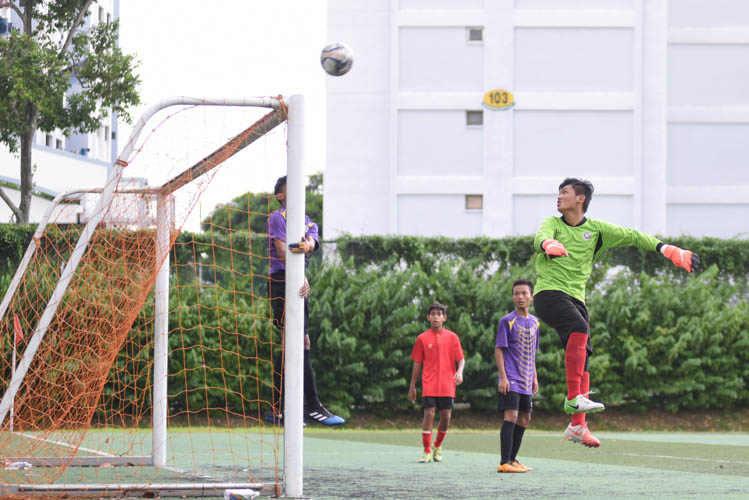 Serangoon Garden Secondary School (Red) clawed back a hard-fought 1-1 draw against NorthLight School (Purple) in the South Zone C Division Football Championship as both sides remain undefeated in Group A. (Photo 1 © Stefanus Ian/Red Sports)