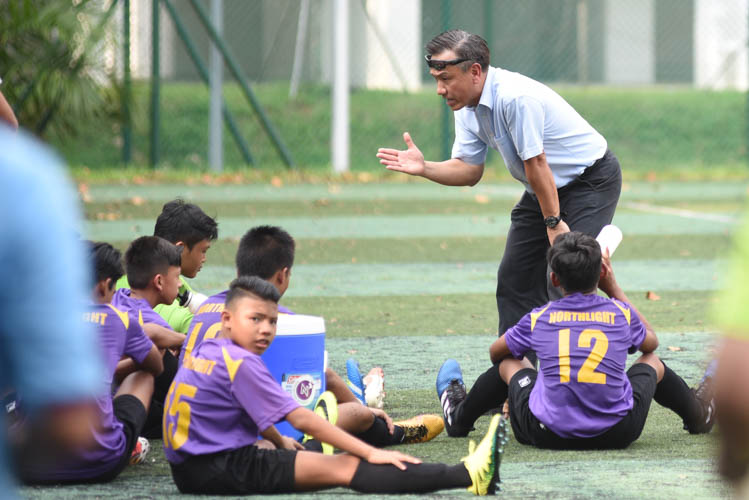 Serangoon Garden Secondary School (Red) clawed back a hard-fought 1-1 draw against NorthLight School (Purple) in the South Zone C Division Football Championship as both sides remain undefeated in Group A. (Photo 1 © Stefanus Ian/Red Sports)
