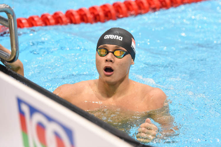 Dylan Koo reacting as he looked at the results board, he narrowly missed out on a podium finish after clocking in 24.77 at the men's 50m butterfly final on the first day of the 13th Singapore National Swimming Championship. (Photo © Stefanus Ian/Red Sports)