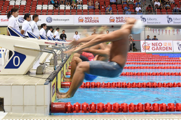 Swimmers launching themselves into the men's 100m backstroke A final on the first day of the 13th Singapore National Swimming Championship. (Photo © Stefanus Ian/Red Sports)