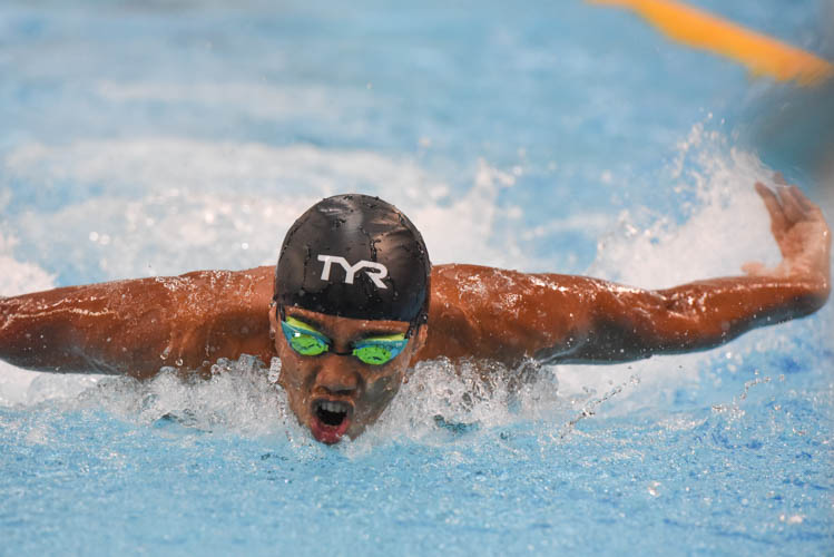 Triady Fauzy Sidiq finishing first in the Men's 100m Butterfly final on the third day of the 13th Singapore National Swimming Championship. (Photo © Stefanus Ian/Red Sports)