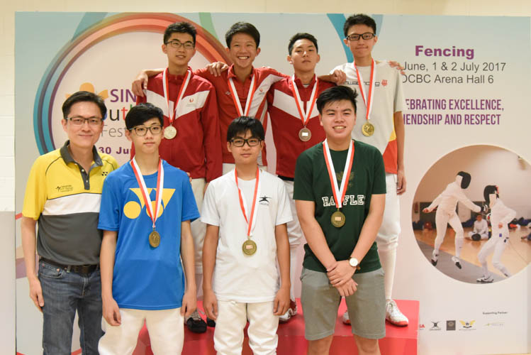 The top eight fencers for the boys' individual foil event posing for a photo after the end of the competition. (Photo © Stefanus Ian/Red Sports)