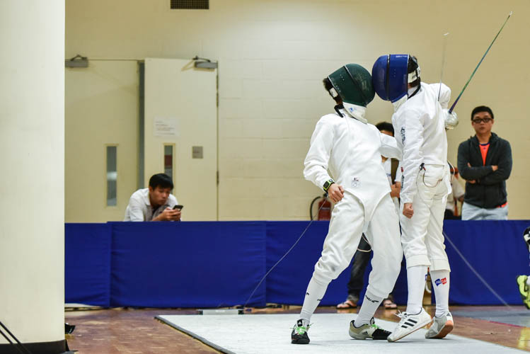 Alexandre Balon and Thadeus Chia clashing during a direct elimination bout in the boys' individual epee category on the final day of the fencing competition at the Singapore Youth Olympics Festival. (Photo © Stefanus Ian/Red Sports)