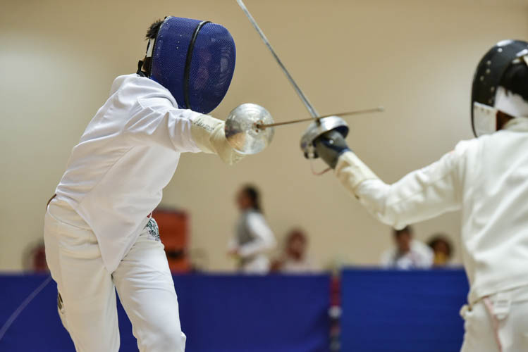 Alexandre Balon of Saint Joseph's Institution making an attack during a bout in the boys' individual epee category on the final day of the fencing competition at the Singapore Youth Olympics Festival. (Photo © Stefanus Ian/Red Sports)