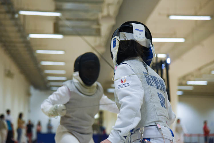 Tiffany Seet of Singapore Sports School competing in the under-14 individual girls' foil category on the final day of the fencing competition at the Singapore Youth Olympics Festival.(Photo © Jeremy Ho/Red Sports)