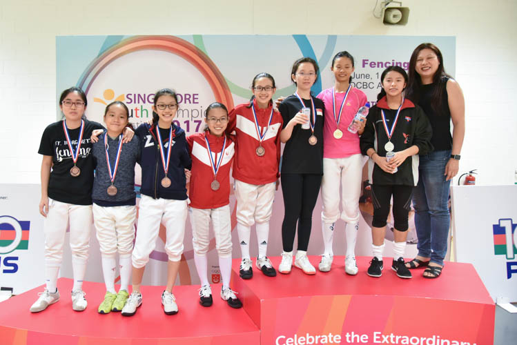 Top eight fencers from the under-14 Individual Girls' Foil category posing with their medals after the end of their competition (Photo © Stefanus Ian/Red Sports)