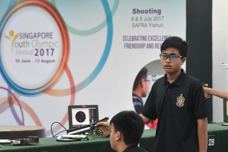 Khair Akmal of RI reacting after a shot during the Air Pistol Men's Y13 category competition, he came in fifth with a score of 486. (Photo ©  Stefanus Ian/Red Sports)