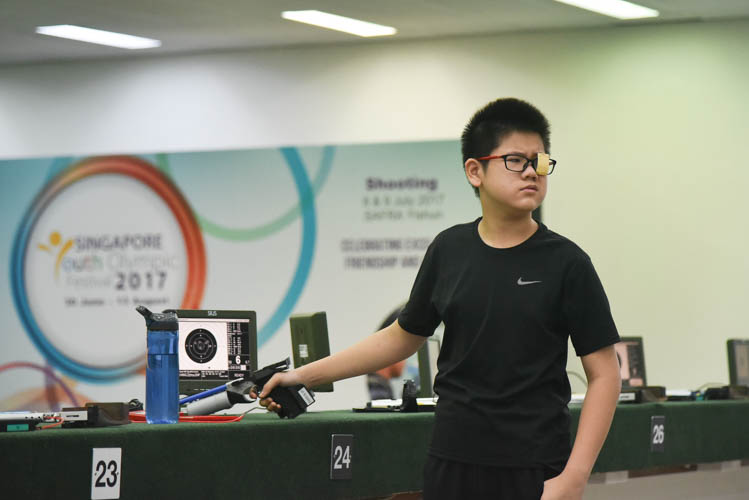 Hang Zizhou of St Hilda's Primary School reacting after his last shot was unable to help him come in first during the Air Pistol Men's Y13 category competition, he came in second with a score of 506. (Photo ©  Stefanus Ian/Red Sports)