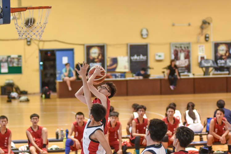 Wayne Tay (CCHY #7) taking a shot in traffic during the North Zone B Division basketball match between Chung Cheng High (Yishun) and Nan Chiau High School. (Photo © Stefanus Ian/Red Sports)