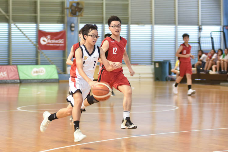 Xavier Phua (NCH #7) making a drive towards the basket during the North Zone B Division basketball match between Chung Cheng High and Nan Chiau High School. (Photo © Stefanus Ian/Red Sports)