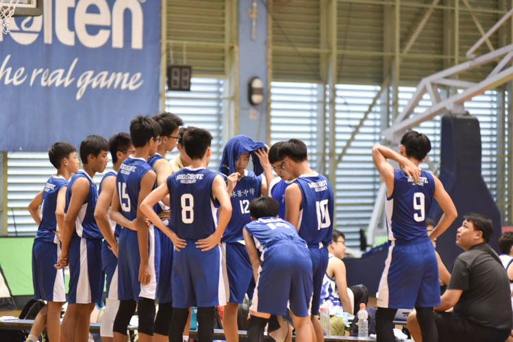 Woodgrove secondary school having a team talk during a timeout in their North Zone B Division basketball match between Hougang secondary and Woodgrove secondary. (Photo  © Stefanus Ian/Red Sports)