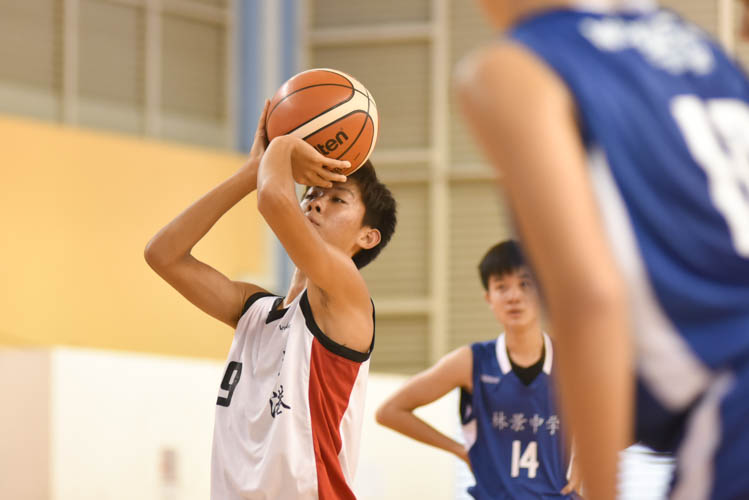 Nigel (HG #12) shooting a free throw during the North Zone B Division basketball match between Hougang secondary and Woodgrove secondary. (Photo  © Stefanus Ian/Red Sports)