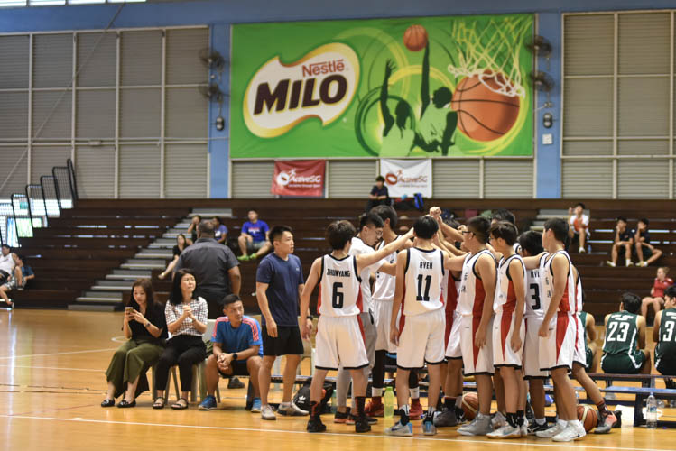Hougang secondary school doing a team cheer during the North Zone B Division basketball match between Hougang secondary and Woodgrove secondary. (Photo  © Stefanus Ian/Red Sports)