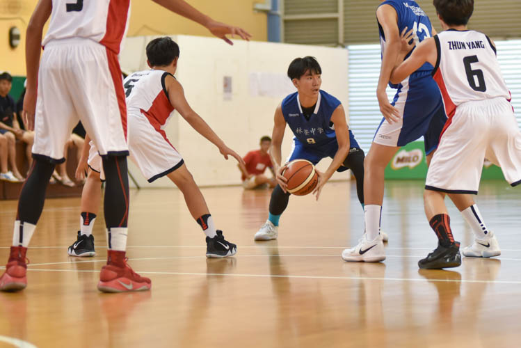 Teo Yung Juen (WG #13) looking for a pass during the North Zone B Division basketball match between Hougang secondary and Woodgrove secondary. (Photo  © Stefanus Ian/Red Sports)