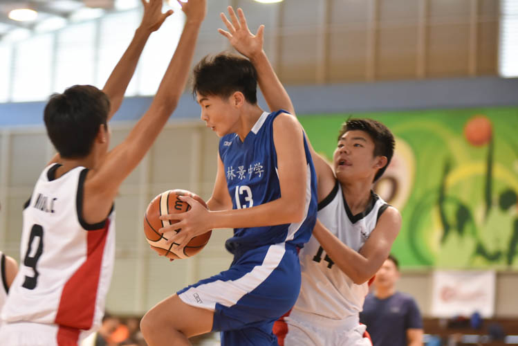 Teo Yung Juen (WG #13) attempting a lay up during the North Zone B Division basketball match between Hougang secondary and Woodgrove secondary. (Photo  © Stefanus Ian/Red Sports)