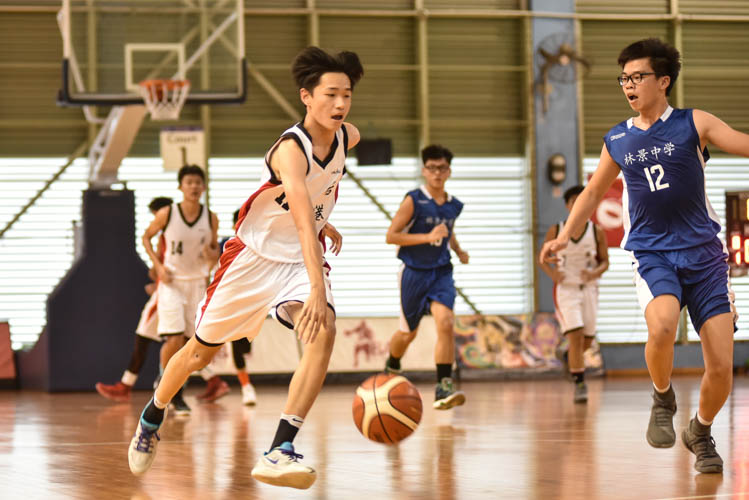 Ryen (HG #11) dribbling the ball during the North Zone B Division basketball match between Hougang secondary and Woodgrove secondary. (Photo  © Stefanus Ian/Red Sports)
