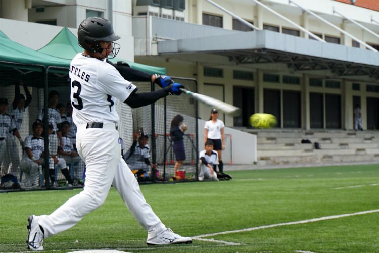 Xavier(RI #13) slugs the ball to left field, making a safe single. (Photo 13 © REDintern Pang Chin Yee.)