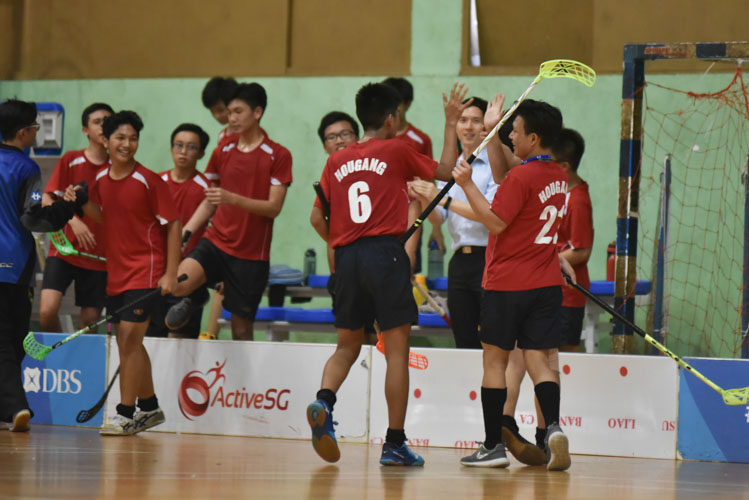 Hougang players celebrate after winning the match. They made a strong comeback to beat Sembawang Secondary School 3-2.